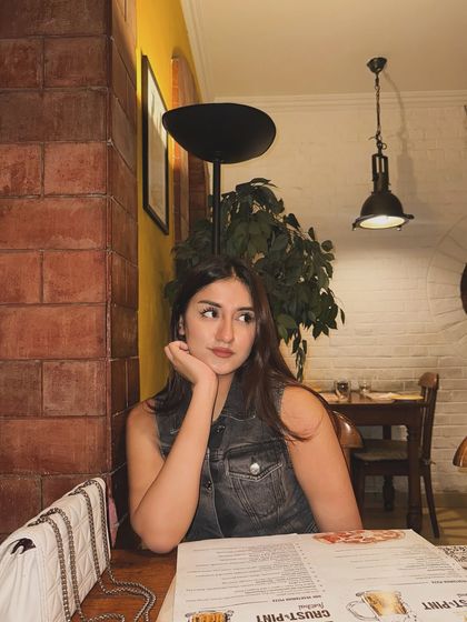 Looking thoughtful while waiting for my food.