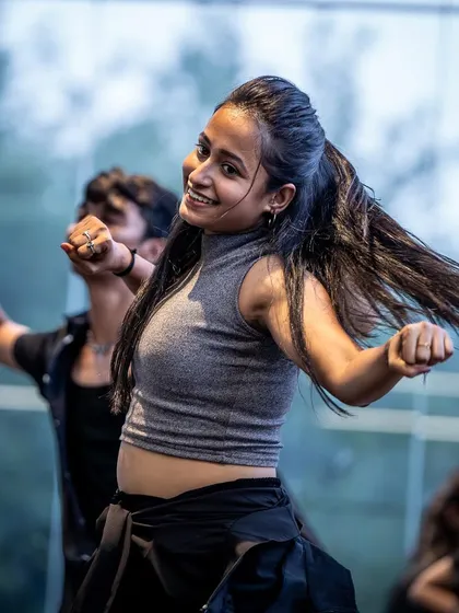 The joy of movement captured in a smile. This student is feeling the music and having a great time.