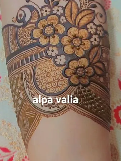 A close-up of a bridal startup design with 3D flowers and peacock elements.
