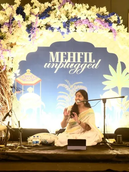 A beautiful moment of musical connection on stage with the vocalist and guitarist.