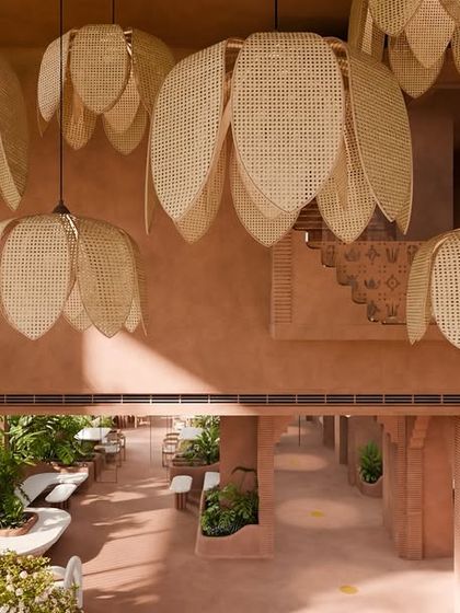 Above the reception, woven petals bloom into lotus-shaped lights. Their soft glow filters gently through the air, scattering delicate patterns that feel both sacred and soothing.