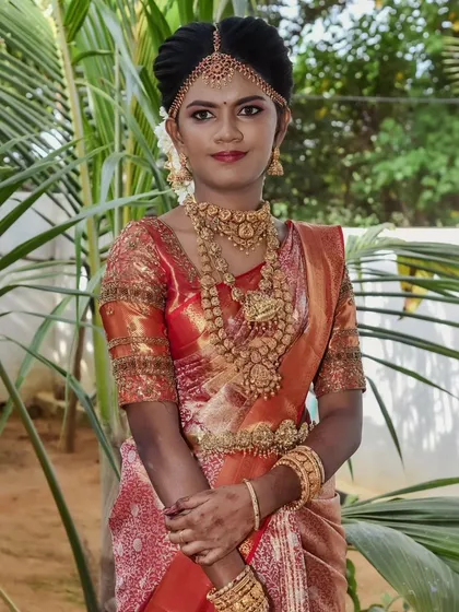 Swapna looking absolutely stunning in her full bridal attire. The outdoor setting highlights the natural and flawless finish of her makeup.