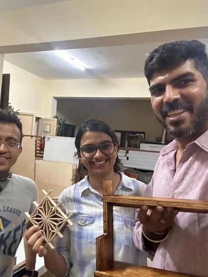 Harsha and Venkappa showing off their weekend's work. One created a beautiful Kumiko piece with the Asa-no-ha pattern, while the other built a practical and elegant wooden shelf.