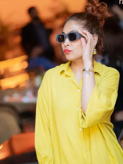 Style and music go hand in hand. A fashionable guest enjoying the vibe.