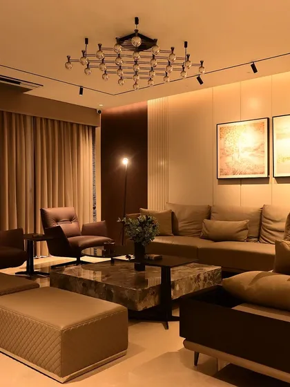 Another view of a completed living room, showcasing how warm, layered lighting can create an inviting atmosphere. Every light is controllable and dimmable.