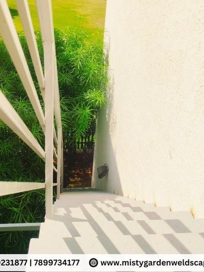 Looking down the modern metal staircase, the clean lines and minimalist design are evident. This style is perfect for contemporary homes and villas.