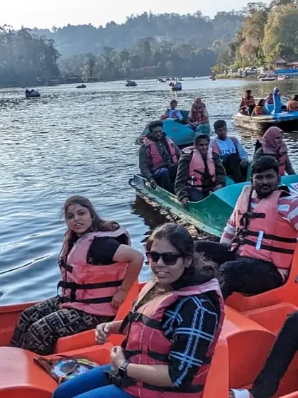 A group enjoying a peaceful pedal boat ride on Kodaikanal Lake, another one of our leisure trip destinations.