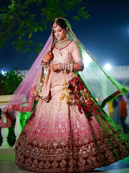 A candid twirl. The flow of her multi-toned lehenga is just beautiful in this shot.