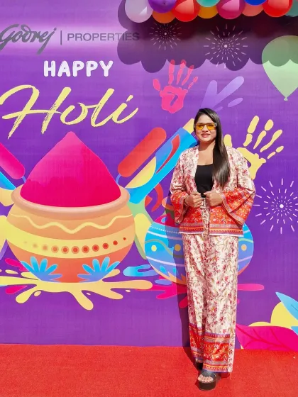Posing at the colorful photo booth for Godrej Properties' Happy Holi event. I love being a part of creating festive and memorable moments for employees.