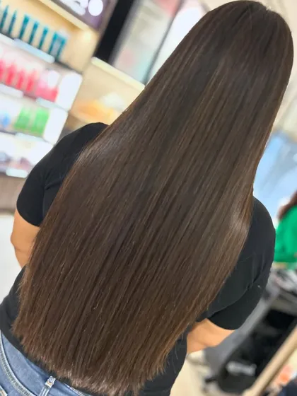 For her first time coloring her hair, we went with a beautiful, glossy look styled straight. This showcases the healthy, shiny result of using quality products like Fibreplex.