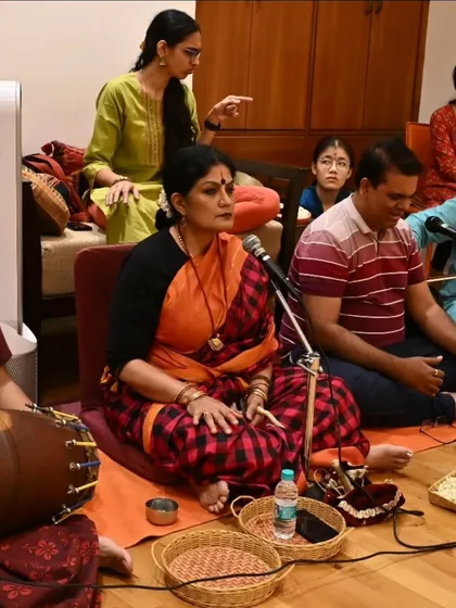 As a guru, I am deeply involved in every aspect of the arangetram, including conducting the nattuvangam during rehearsals. This is a candid moment from the music session for Anvita Jain's performance.