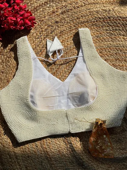 The white version of my handcrafted pearl blouse, made from pure silk with intricate moti work.