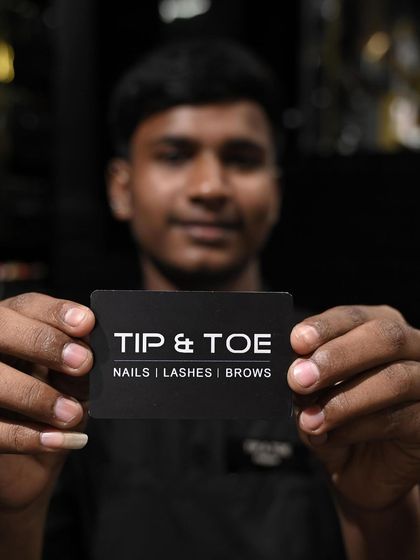 A portrait of a team member, showcasing the friendly and professional staff you'll meet at our salons.