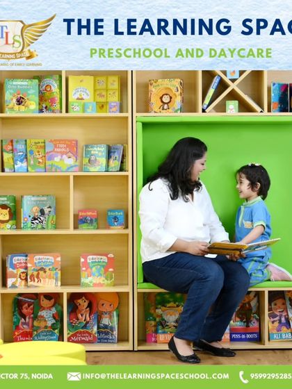 A teacher and child share a story in our reading nook. These moments of connection are vital for building language skills and fostering a positive association with books.