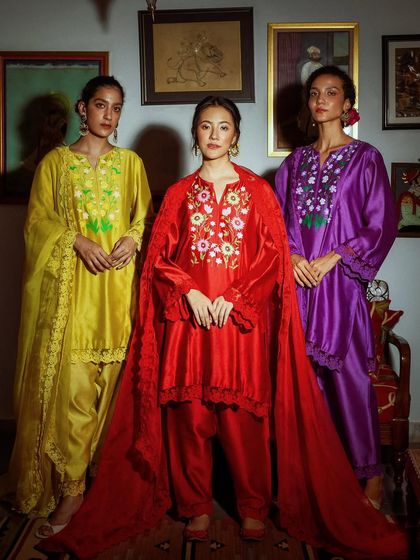 A powerful group shot for Baavli, showcasing three distinct, vibrant looks from their festive collection.