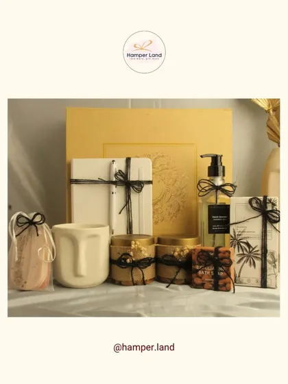 A modern and artistic hamper for dad. This set includes a unique face-shaped mug, a journal, hand soap, and jars of nuts, all tied with simple black string for a minimalist aesthetic.