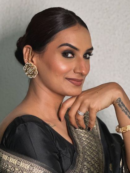 A direct portrait of the Deepika-inspired makeup. The intense smokey eye is the centerpiece, balanced by a neutral lip and perfectly sculpted skin.