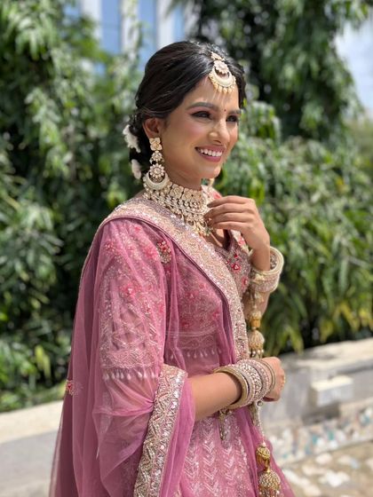 A happy and confident portrait of the bride. The makeup is designed to look flawless from every angle.