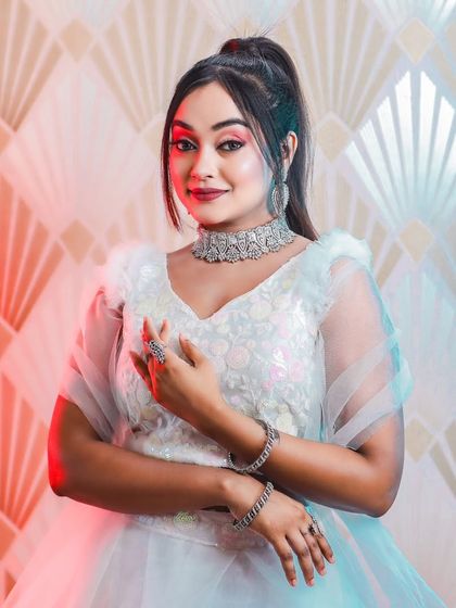 This series of photos and video shows a model in a modern white lehenga, wearing our diamond-look choker set. It's a perfect look for a sangeet or cocktail party.