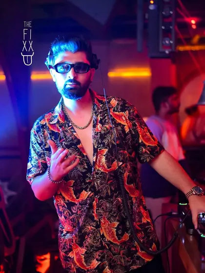 Bringing a tropical vibe with my shirt at The Fixx Bar. Ready for a hot Friday night.