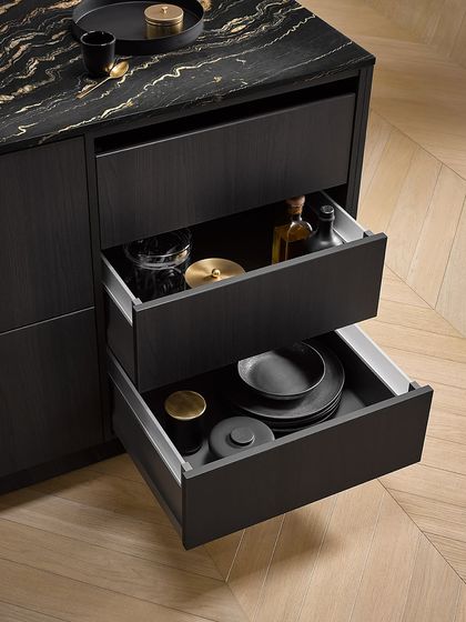 Deep drawers in our Black Fine Oak collection, featuring a color-coordinated interior organizer in dark ash for a seamless, high-end look.