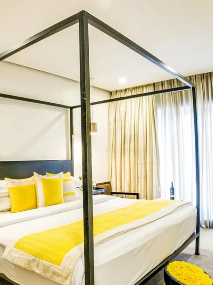 Sleep like royalty in our signature four-poster bed. This room combines classic elegance with modern design, featuring plush bedding and a bright, airy atmosphere for a truly restful night.