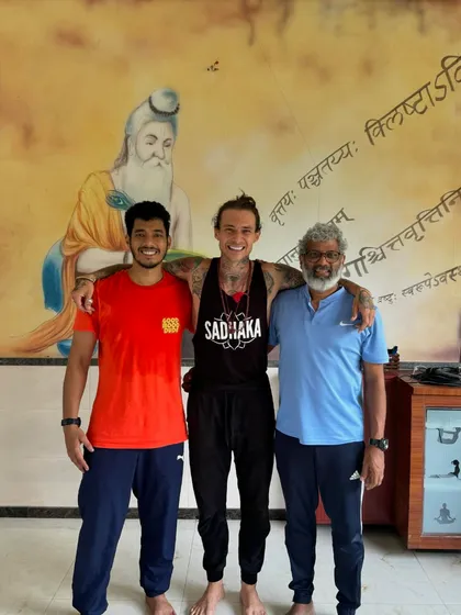 It is a privilege to share the practice of yoga with students and teachers from all over the world. Here I am with fellow practitioners at the studio, united by our shared journey.