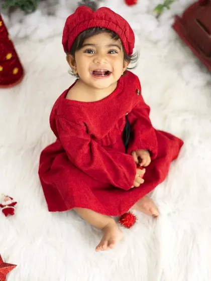 A joyful, candid moment from a Christmas-themed session. We love capturing these happy, spontaneous smiles.