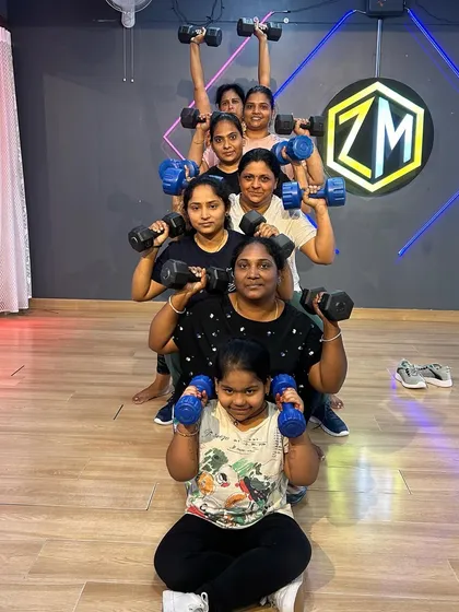 Fitness is for everyone, and I love creating a family-friendly environment. This picture captures multiple generations working out together, proving that strength and health have no age limit.