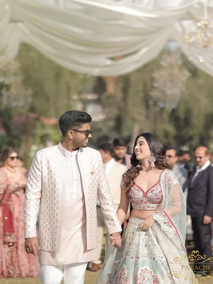 A look of love shared between the couple as they walk towards their engagement stage.
