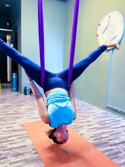 Hanging upside down in an aerial inversion is one of the best things you can do for your spine. The hammock supports my body completely, allowing for a deep, restorative stretch that releases all tension.