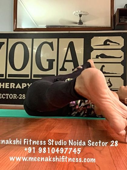 A more advanced variation, Karnapidasana, or knee-to-ear pose. This is a deep forward bend that calms the nervous system.