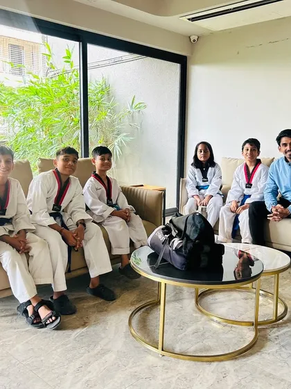 Taking a moment to relax and connect with my senior students after a tough training session.