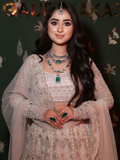 My stunning bride Aastha on her engagement day. I created a look with pink smokey eyes and a flawless base to complement her beautiful pastel and emerald ensemble.