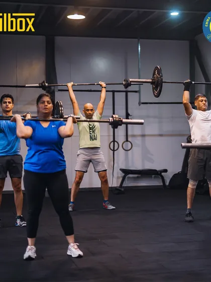 You're not just joining a gym, you're joining a team. This is a typical morning at Zealbox, our cross-functional training space, where members push each other through challenging group workouts like overhead presses.