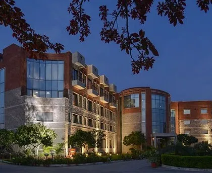 The Institute for Studies in Industrial Development (ISID) in New Delhi, illuminated at dusk. I believe in creating spaces that feel right, and here, the combination of red brick, stone, and thoughtful lighting creates an inviting atmosphere for research and learning. This is an example of sustainable institutional architecture that stands the test of time.