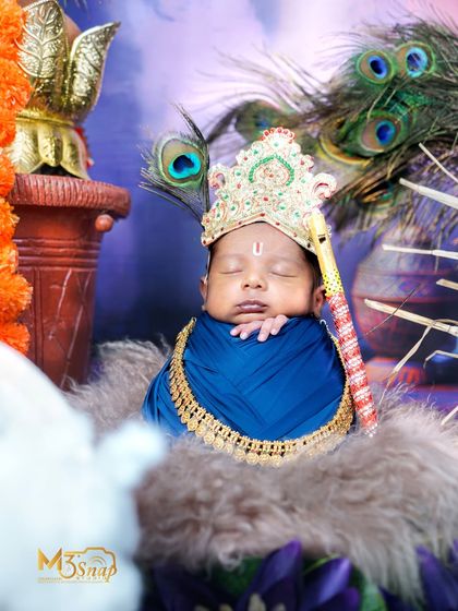 A divine portrait of the newborn Krishna, with a peacock feather in his crown. The composition is balanced and beautiful.