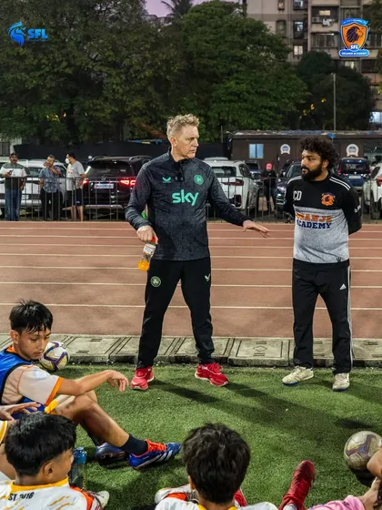 Heimir discusses strategy with our SFL Oranje coaches during a training session. This continuous dialogue ensures our coaching philosophy is applied consistently across all age groups.