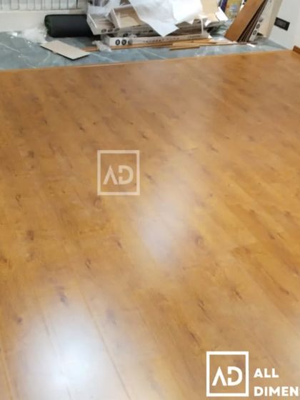 This image captures the installation process, showing the new wooden flooring being laid over the subfloor. My process ensures a perfectly level and durable finish that will last for years.