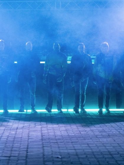 An atmospheric shot of the "To Da Bone" dance crew on a smoke-filled stage. This image captures the intense, rebellious energy of the jumpstyle performance we hosted.