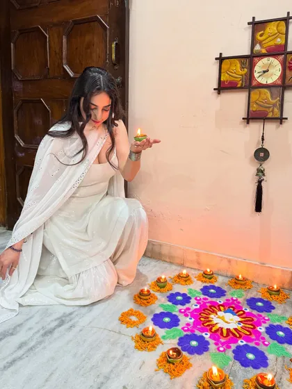Another angle of my Diwali celebration look, showcasing the beautiful rangoli and the flow of the sharara pants.