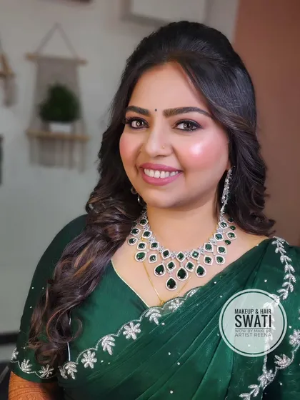 Henoy looking radiant and happy for her engagement. The soft curls and glowing makeup by Swati were the perfect choice.