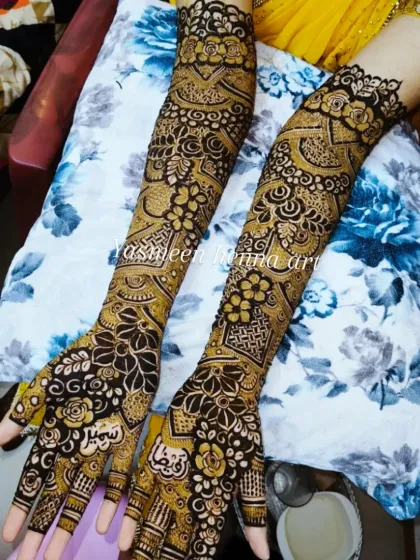 Faiza's mehndi journey, from the fresh paste to the final look. This design features a mix of geometric and floral patterns, with names personalized on the palms.