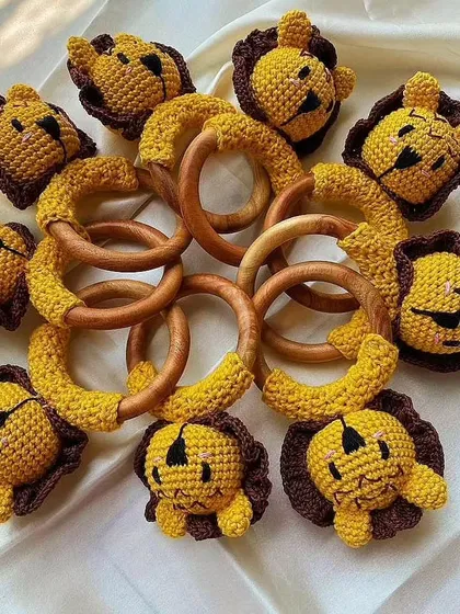 This picture shows my lion rattles in two different color options, yellow and brown. They are all made with the same high-quality, baby-safe materials, ensuring a safe and fun playtime.