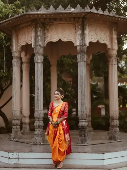 A full-length view of the bride in her stunning nauvari saree. I provide saree draping services to ensure the entire look is cohesive and elegant.