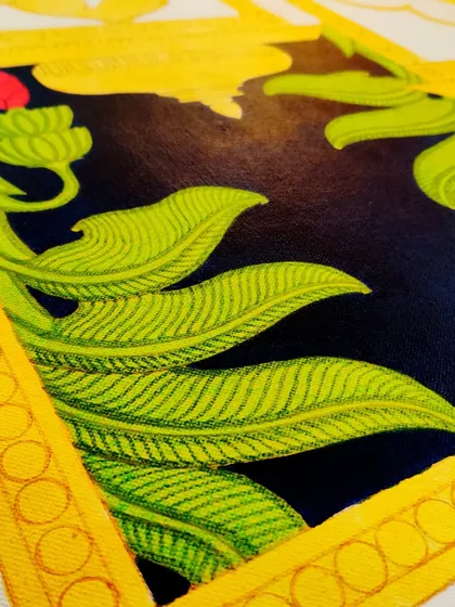 A close-up of the painted leaves in the Srinathji piece, showing the fine-line detail.