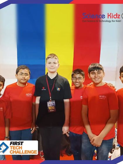 A moment of international camaraderie at the First Tech Challenge. Our students connect with a participant from another country, sharing their passion for robotics and learning from each other.