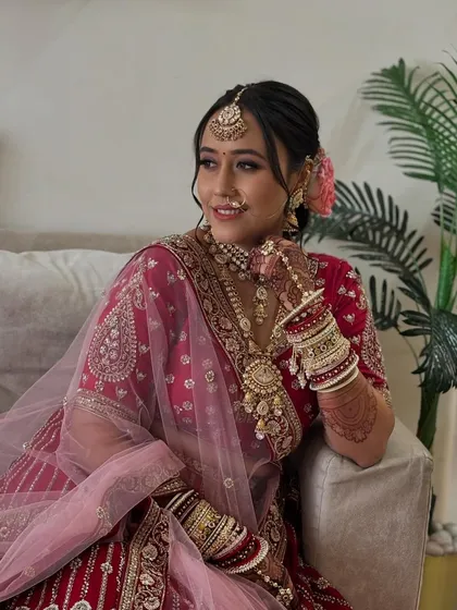 A soft and elegant pose. The makeup is flawless and timeless, ensuring she will love her wedding photos for years to come.