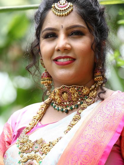 A happy mom-to-be glowing at her baby shower. She is wearing a beautiful temple jewellery set from my collection to celebrate this special milestone.