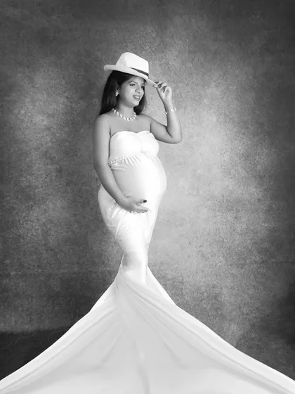 A stylish black and white version of the drape portrait with a hat. The monochrome edit gives it a classic, almost vintage Hollywood feel.